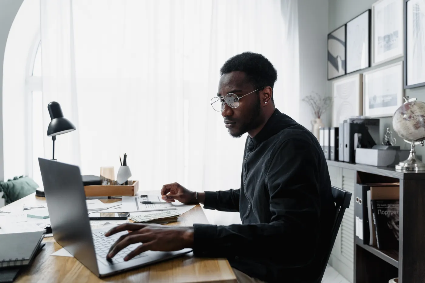 A business owner reviewing their accounts at a desk